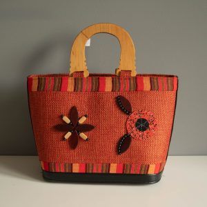 oranje schoudertas met houten bloem